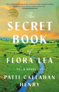 Cover of The Secret Book of Flora Lea. Photo of a green countryside with a river running through it.