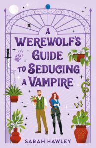 Cover of A Werewolf's Guide to Seducing a Vampire. Cover is light purple. Man and woman on the bottom center look over their shoulders at each other subtly. There also are plants surrounding them, a dagger, a spider and a butterfly. The border is an iron arch.